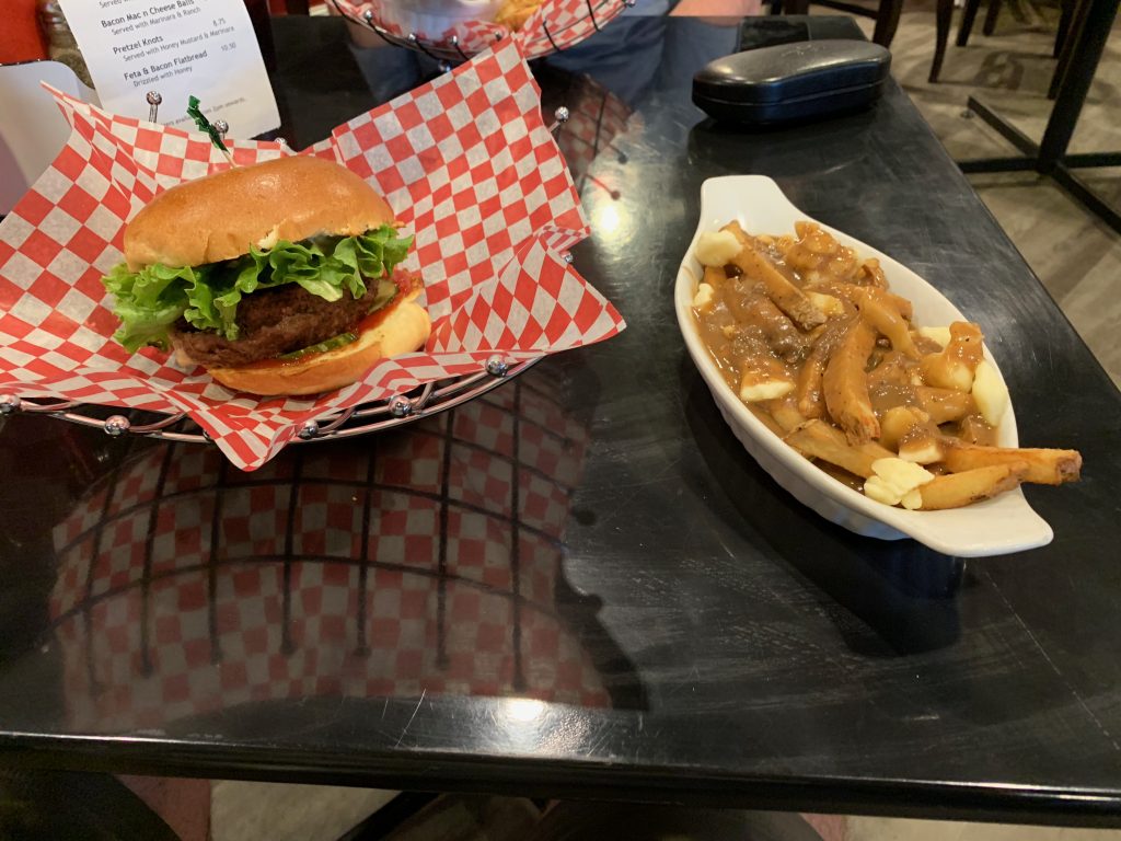 Naina's poutine stuffed burger and a side of poutine!  Yes please!