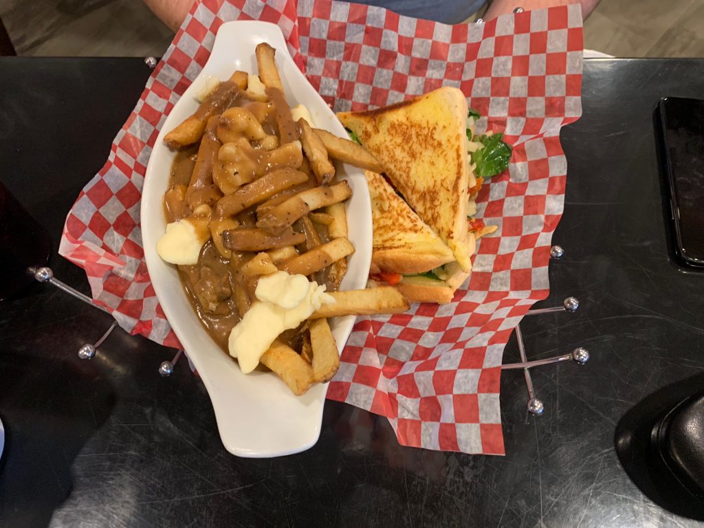 Naina's veggie grilled cheese with a side of poutine.