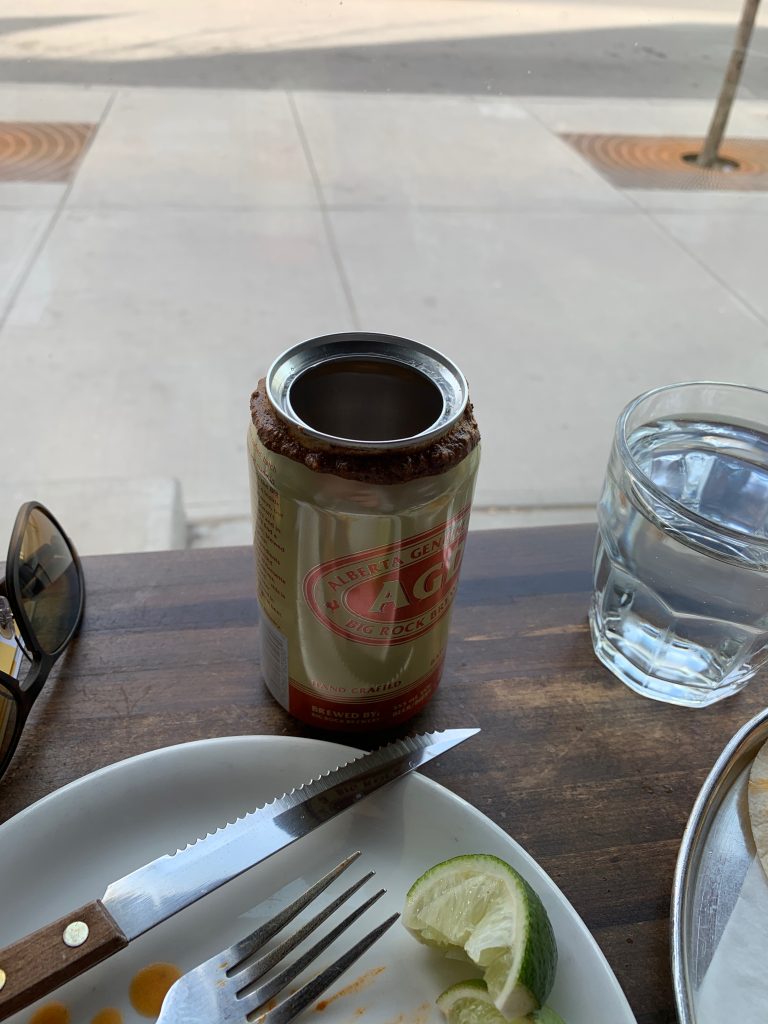 Happy hour beer at native tongues.  We've never seen  a beer can served like this before.